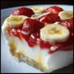 banana pudding strawberry cheesecake - featured image